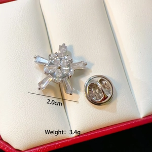 Close-up of a luxury silver snowflake brooch with zircons, measuring 2cm and weighing 3.4g