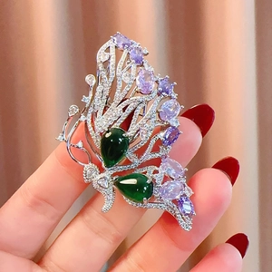 Luxury butterfly brooch with green and purple gemstones on a silver base for women