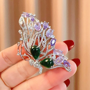 Elegant butterfly brooch with purple and green crystals on silver metal for women