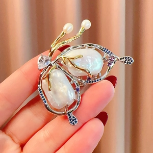 Elegant butterfly brooch with baroque pearls and multicolored zircon crystals for women