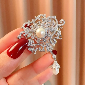 Vintage pearl brooch with crystals and tassel, elegant accessory for formal suits