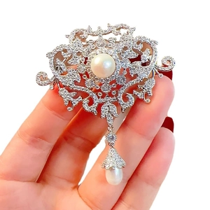 Vintage palace style brooch with white pearls and tassel pendants in silver finish