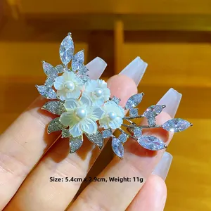 Elegant floral brooch with natural shell flowers and zircon leaves, size 5.4cm x 2.9cm