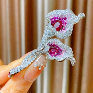 Elegant Calla Lily brooch with sparkling red and pink crystals on silver-tone metal