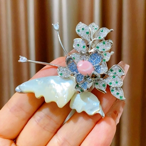 Detail of butterfly brooch with natural shell wings and micro-pave crystals decoration