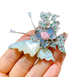 Elegant butterfly shell brooch with pink gemstone and micro-set colored cubic zirconia