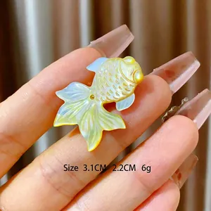 Elegant shell goldfish brooch with magnetic clasp in a gold-tone luxury finish