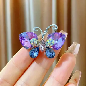 Purple crystal butterfly brooch in gold plating showing size 3.6cm by 2.6cm