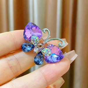 Elegant purple crystal butterfly brooch with silver base and multicolored stones