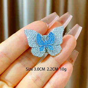 Double-layered butterfly brooch with micro-paved zircons and green crystal magnetic buckle