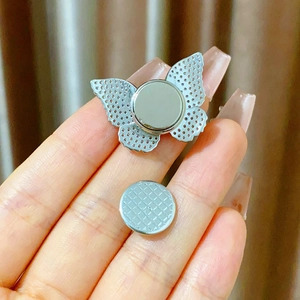 Detail of silver magnetic butterfly brooch with zircon inlays and magnetic back closure