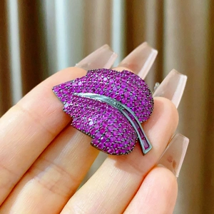 Elegant French leaf magnetic brooch with ruby-red pavé crystals and dark metal details