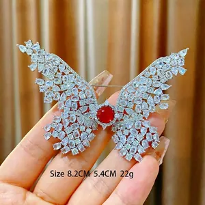 Exquisite butterfly brooch with silver zircon crystals and a red ruby center, 8.2cm size