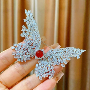 Exquisite silver butterfly brooch with white zircon wings and a red center stone