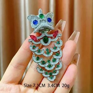 Exquisite Chinese lion dance brooch with rhinestones, colorful gems, and elegant tassels