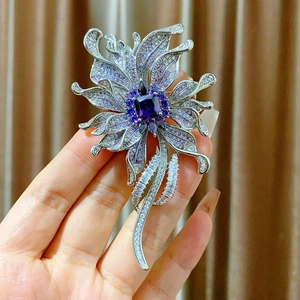 Elegant silver flower brooch with purple zircon stones and tassels for formal wear