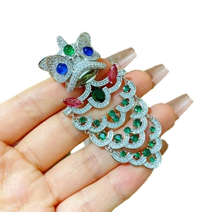 Exquisite Chinese lion dance brooch with colorful gemstones and tassel in silver finish