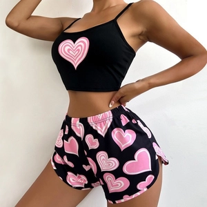 Women's 2-piece black pajama set with pink heart print, cami top and elastic shorts