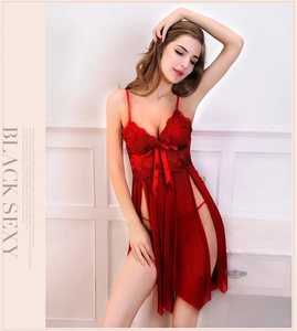 Detail of red lace lingerie set with satin bow and delicate floral embroidery details