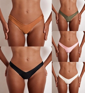 Detail view of five colors of V-cut high leg bikini bottoms in sleek satin fabric