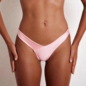 Detailed close-up of light pink high-cut bikini bottoms with a V-shaped crossover waist