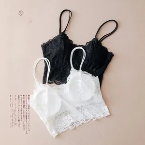 Flat lay of elegant black and white floral lace bralettes with fine eyelash lace trim