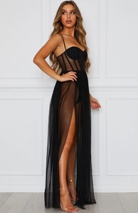 Detail of sheer black mesh dress featuring a corset bodice and high side slit