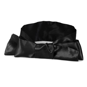 Detailed view of a wide black satin bow belt featuring a glossy silk-like texture finish