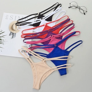 Detail of colorful bikini thongs with dual waist straps and decorative metal rings