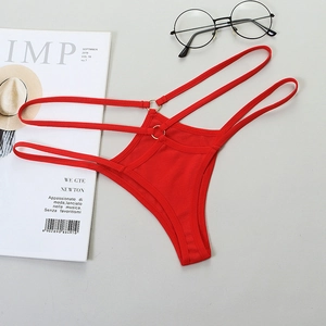 Close-up of red thong with hollow straps and metal ring details on a flat background