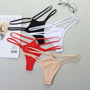 Set of four sexy minimalist G-string thongs in black, white, red, and beige with metal rings