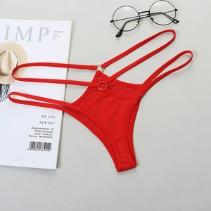 Red strappy thong bikini with gold metal rings and cutout design on grey background