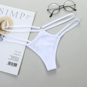 Sexy white thong with triple strappy waist and gold ring detail in minimalist flat lay