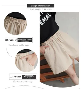 Detail view of cotton shorts showing drawstring waist, side pockets and loose fit design