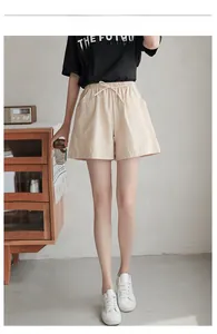 Beige cotton-linen blend wide-leg shorts with elastic drawstring waist and side pockets