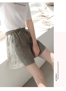 Close-up of elastic waistband with drawstring and textured fabric on casual shorts