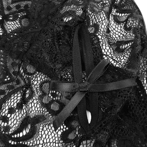 Close-up of black floral lace lingerie featuring a delicate satin bow detail