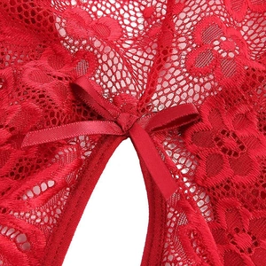 Detailed macro view of red floral lace lingerie with a satin bow and open cutout design