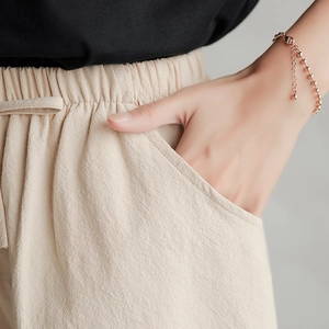 Women's loose beige cotton blend shorts with elastic drawstring waist and side pockets
