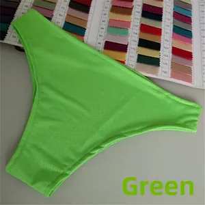 Close-up of vibrant green textured bikini bottoms with elastic quick-dry fabric details