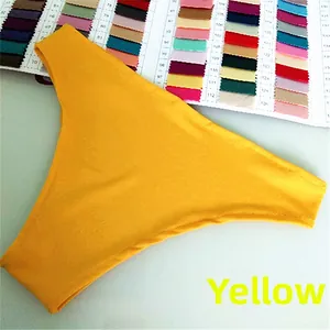 Detail of yellow high-elasticity bikini bottoms with precise edge stitching and fabric texture
