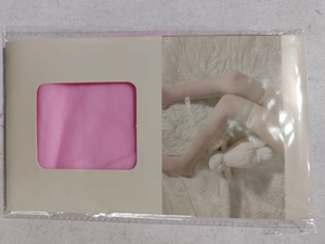 Pink children's pantyhose in retail packaging with model illustration and paper card