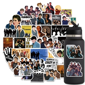 50pcs waterproof The Outsiders stickers set displayed on a black water bottle and laptop