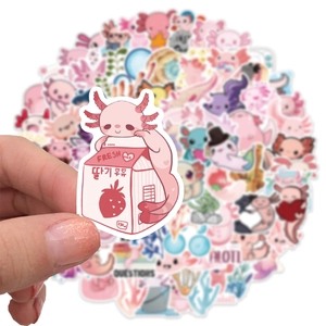 Close-up of waterproof pink axolotl sticker with strawberry milk design in a hand