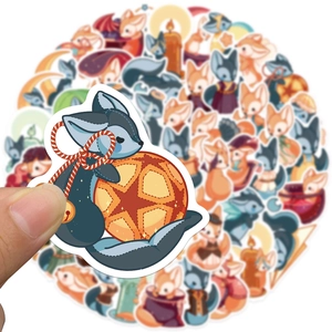Macro shot of waterproof cartoon fox stickers for DIY laptop and luggage decoration