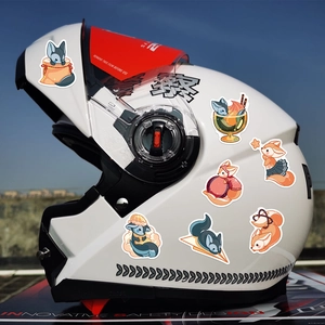 Waterproof cartoon fox stickers applied on a white motorcycle helmet for custom DIY decoration