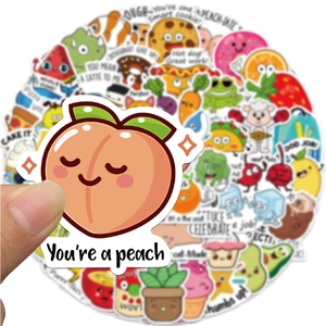 Hand holding a peach pun sticker from a set of 50 colorful waterproof reward decals