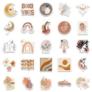 Bohemian style stickers featuring moon and rainbow designs in earth tones for laptops