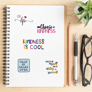 52-piece set of motivational waterproof stickers for laptops and journals on wooden desk