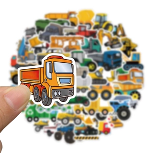 Hand holding an orange dump truck sticker from a 50-piece waterproof engineering car set